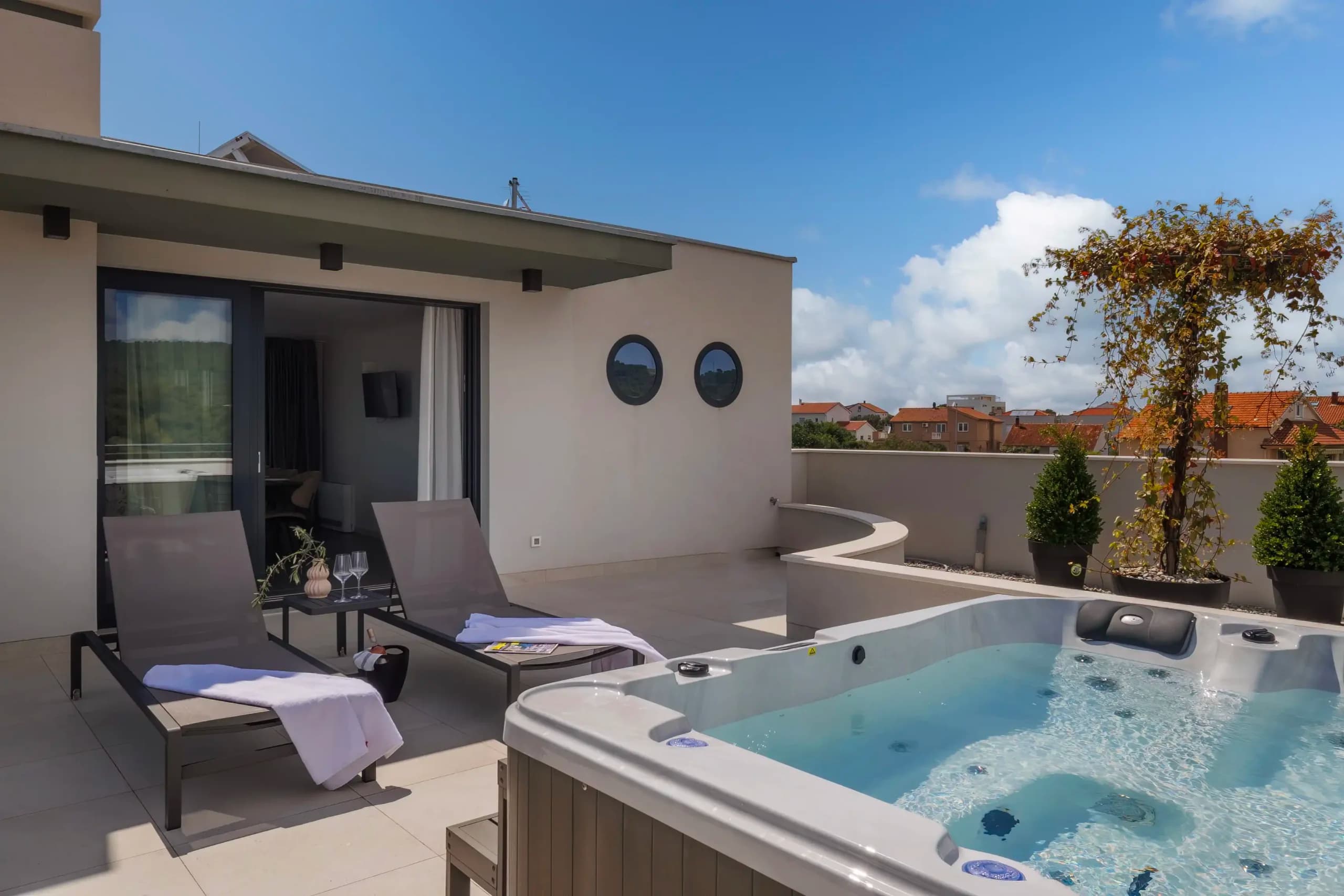 Rooftop jacuzzi with sun loungers